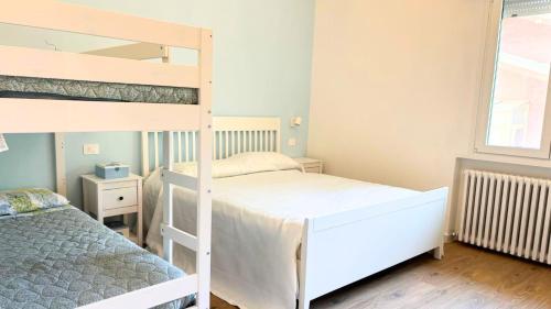 Postel nebo postele na pokoji v ubytování CN011 - Cesenatico, nuovo trilocale con posto auto in posizione centrale