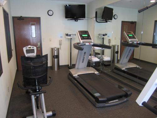 a gym with three treadmills and a treadmill at Holiday Inn Express Hotel & Suites Dubois by IHG in DuBois