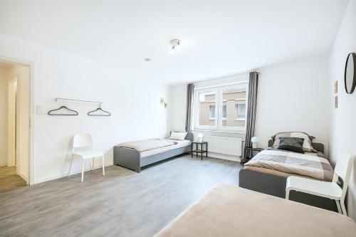 Postel nebo postele na pokoji v ubytování VAZ Apartments Langerfeld für Fachkräfte und Monteure, TV, WLAN, Küche, nahe 3M und EDE