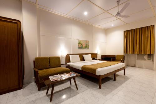 Postel nebo postele na pokoji v ubytování Grand Hotel Mumbai - Ballard Estate, Fort