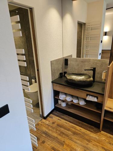 a bathroom with a sink and a mirror at first mountain Hotel Zillertal in Aschau