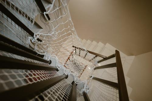 a net on the side of a stair case at Shan Hai Yun Jian in Wujie