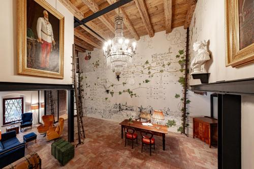 a living room with a wall with a drawing on it at Castel Sallegg Suites Adults only in Caldaro