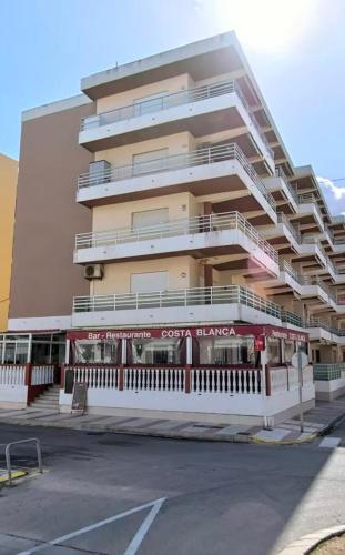 a large building with balconies on the side of it at Apartamento Alicia in Daimuz