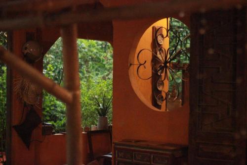 a room with a mirror and a window at Yên homestay in Hoi An
