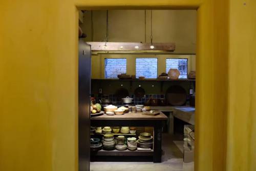 a kitchen with a counter with food on it at Yên homestay in Hoi An