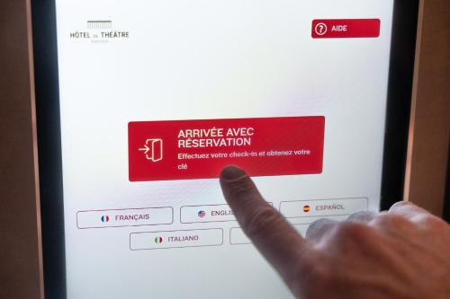a hand pointing to the activate msg registration page on a computer screen at Résidence du Théâtre in Bordeaux