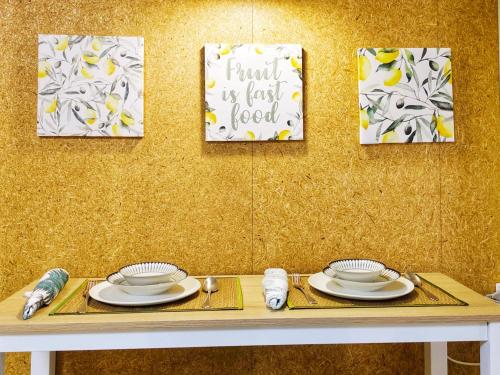 a table with plates and a sign that reads trust is easy food at Peaceful Condo at Happening Nimman in Chiang Mai