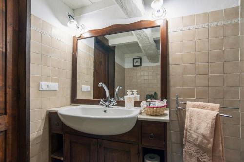 a bathroom with a sink and a mirror at Fattoria Ca' di Fatino in Castiglione dei Pepoli