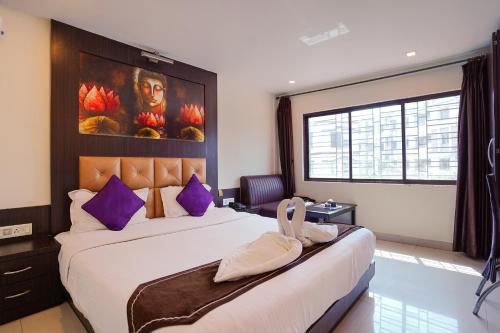 Ένα ή περισσότερα κρεβάτια σε δωμάτιο στο Sheldon Hotel