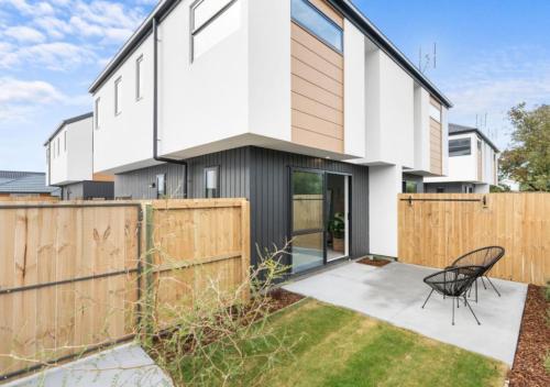 a modern house with a black and white facade at Brand New 3BR Home with Parking in Christchurch