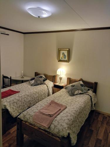 En eller flere senge i et værelse på Villa Lovisa