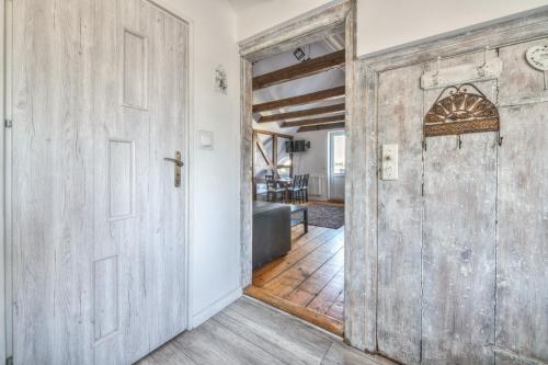 an open door to a living room with a table at Monte Cassino 58 with City View by NorthSide Apartments in Sopot