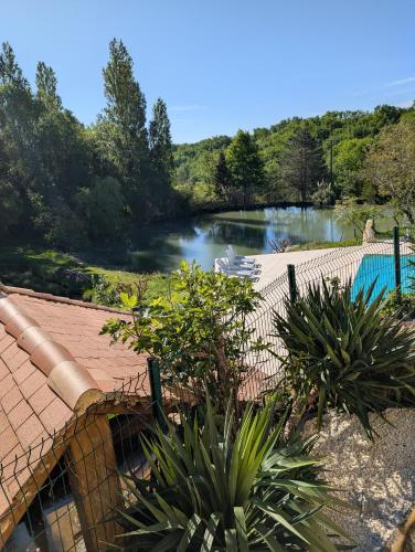 a view of a river from a house at Maison de campagne 8 couchages avec piscine et lacs in Sainte-Radegonde