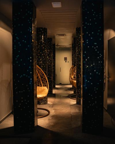 a row of chairs in a room with lights at Altafiumara Resort & Spa in Villa San Giovanni