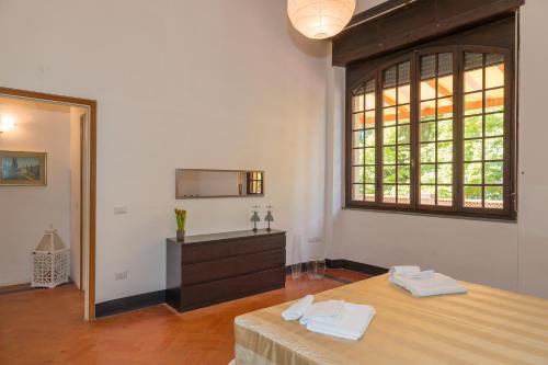 Ένα ή περισσότερα κρεβάτια σε δωμάτιο στο Villa I Tigli - Pervinca