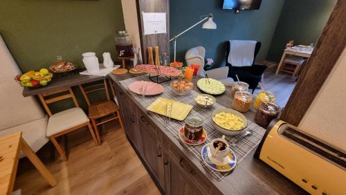 a kitchen with a counter with food on it at Vila Koman Jezersko in Zgornje Jezersko