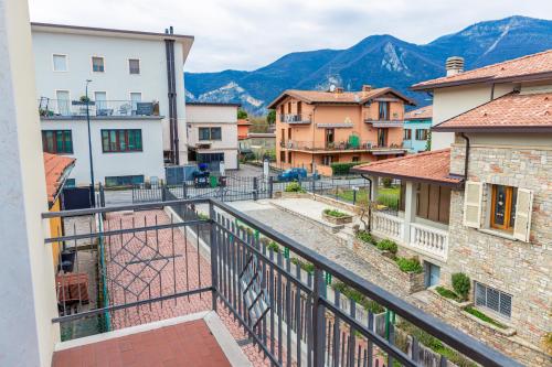 a view from a balcony of a town with mountains at Casa Vacanza Anna Maria in Clusane sul Lago