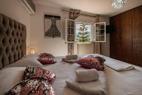 A bed or beds in a room at Eleni's Apartment Top Floor