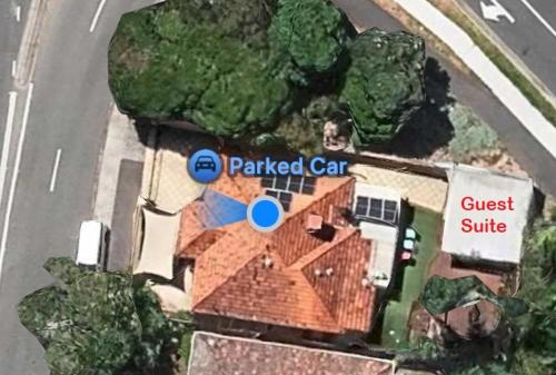arial view of a house with a parked car and a street at Guest suite in Brighton in Melbourne