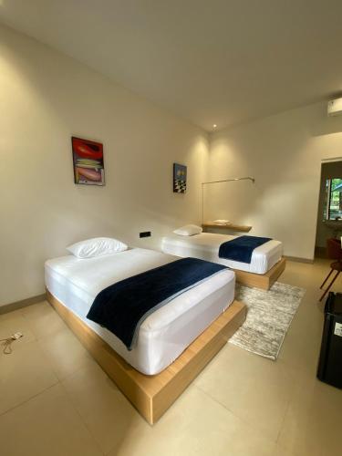Tempat tidur dalam kamar di Bale Seccha
