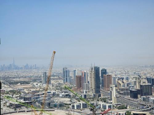 an aerial view of a city with construction equipment at New Renovated Stylish 1 Br Dubai View 73 Floor in Dubai