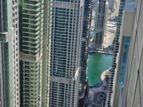 an aerial view of a city with tall buildings at New Renovated Stylish 1 Br Dubai View 73 Floor in Dubai