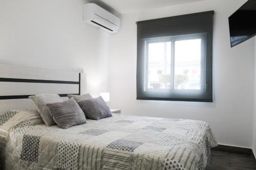 Ένα ή περισσότερα κρεβάτια σε δωμάτιο στο Casa Planta Baja Bungalow 58