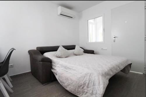 Postel nebo postele na pokoji v ubytování Casa Planta Alta Bungalow 29