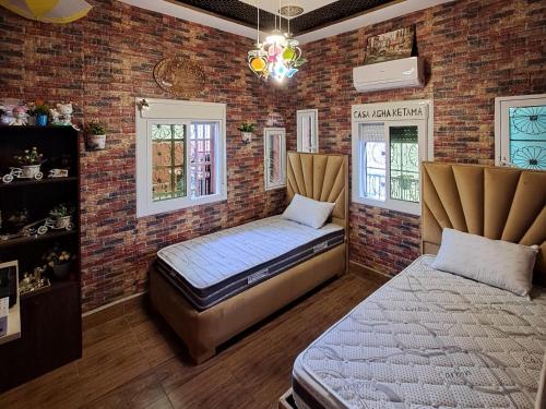 Ένα ή περισσότερα κρεβάτια σε δωμάτιο στο house Ketama vip