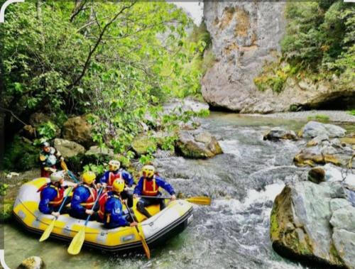 a group of people in a raft in a river at Casa vacanza P&G in Laino Castello