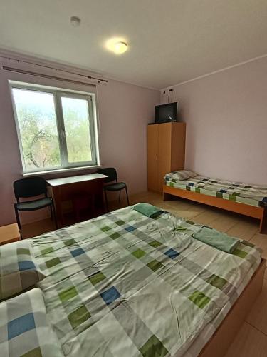 Ένα ή περισσότερα κρεβάτια σε δωμάτιο στο Green Hotel