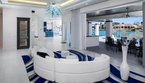 a living room with a white couch and a table at Meridian Blu in Marco Island