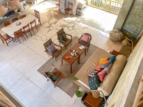 an overhead view of a living room with a couch and tables at Baia Nest TURINGAN Loft, Self-Service Breakfast, Near the Beach, Pet Friendly with a Fee in Gubat