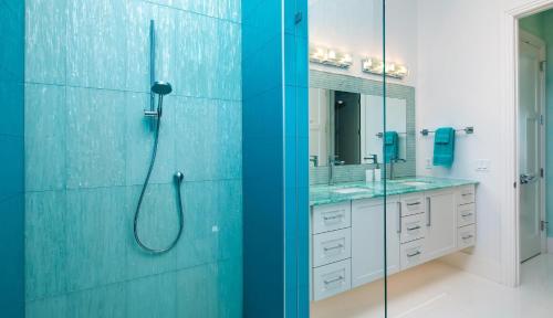 a bathroom with two sinks and a shower at Meridian Blu in Marco Island