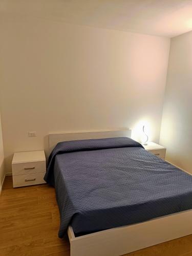 Ένα ή περισσότερα κρεβάτια σε δωμάτιο στο La Roggia - Appartamento con 2 camere e garage