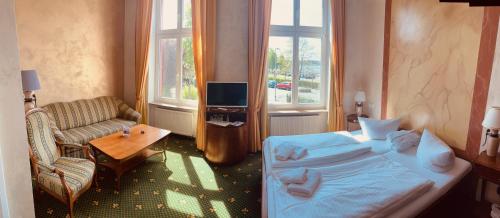 Waren Müritz Hotel Harmonieにあるベッド