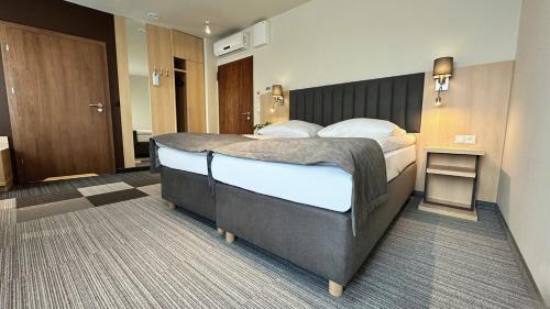 Кровать или кровати в номере Hotel Turkus