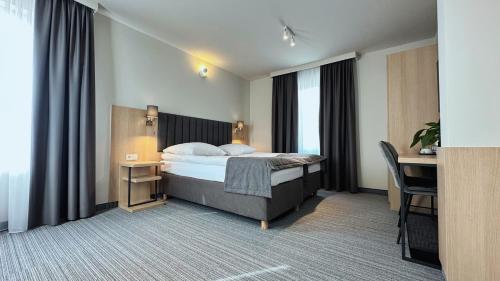 Кровать или кровати в номере Hotel Turkus