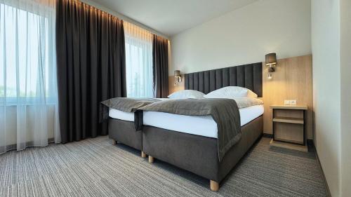 Кровать или кровати в номере Hotel Turkus