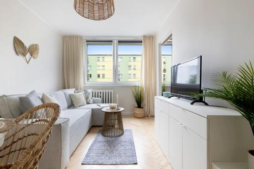 TV a/nebo společenská místnost v ubytování Elite Apartments Brzeźno Seaside