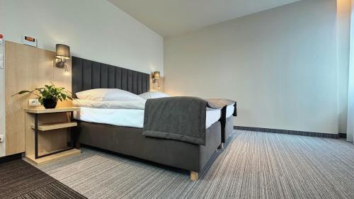 Кровать или кровати в номере Hotel Turkus
