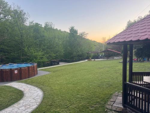 a park with a playground and a gazebo at Kuca za odmor Marjanovic in Gornji Milanovac