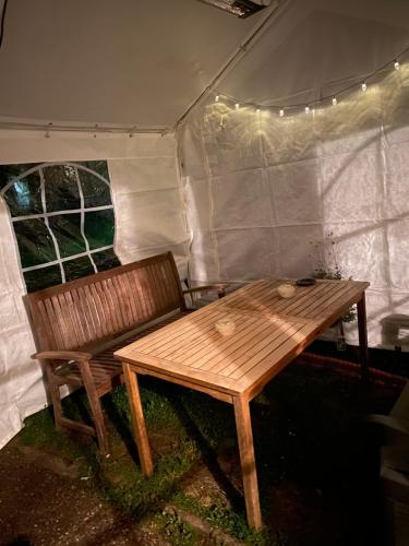 a wooden bench sitting inside of a tent at gemütliche rustikale Wohnung mit Kamin und optionalem Whirlpool in Bad Sobernheim