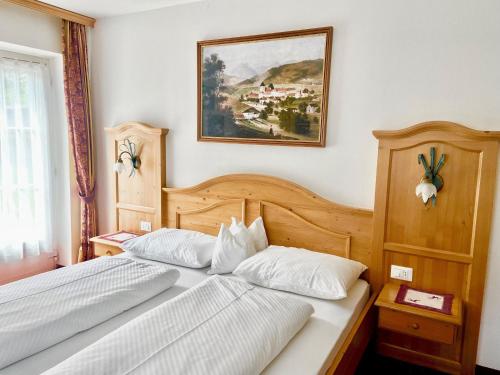 Ένα ή περισσότερα κρεβάτια σε δωμάτιο στο Cesa Vedla Dolomites
