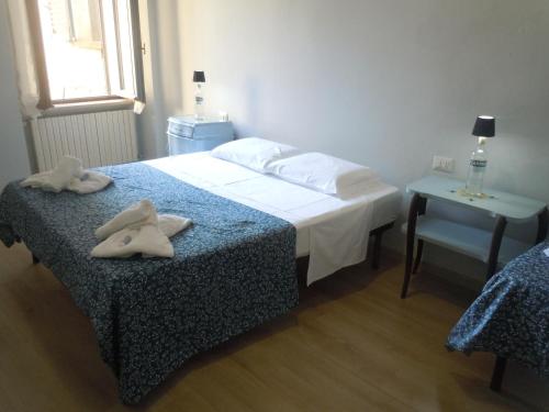 Postel nebo postele na pokoji v ubytování MARTINI e CAMPARI