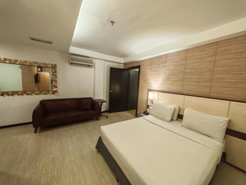 Ένα ή περισσότερα κρεβάτια σε δωμάτιο στο Citrus Hotel Johor Bahru by Compass Hospitality