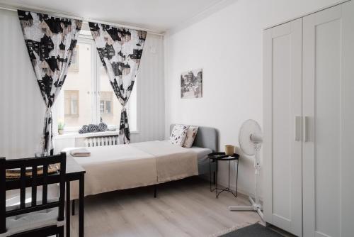 Postel nebo postele na pokoji v ubytování Cozy Studio Apt in Kamppi with Perfect Location