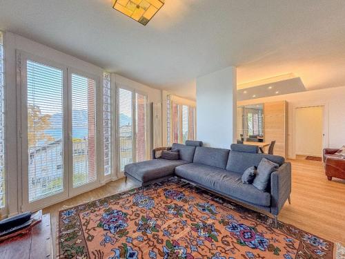a living room with a couch and a rug at Vera in Oggebbio