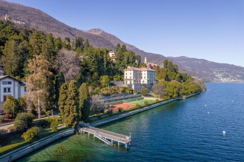 arial view of a lake with houses and a dock at Vera in Oggebbio